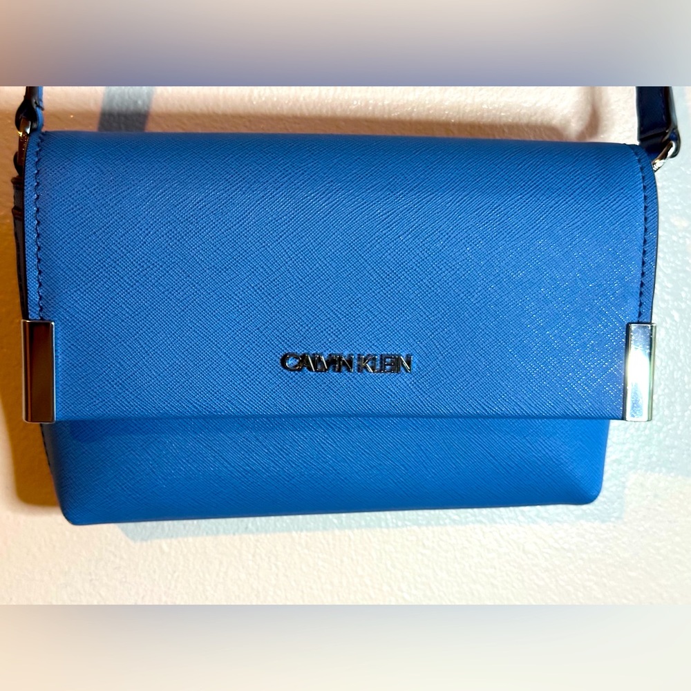 Blue Calvin Klein small hand bag.
